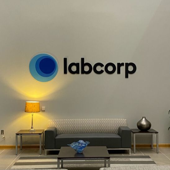 A Signage Industries worker putting up a new sign